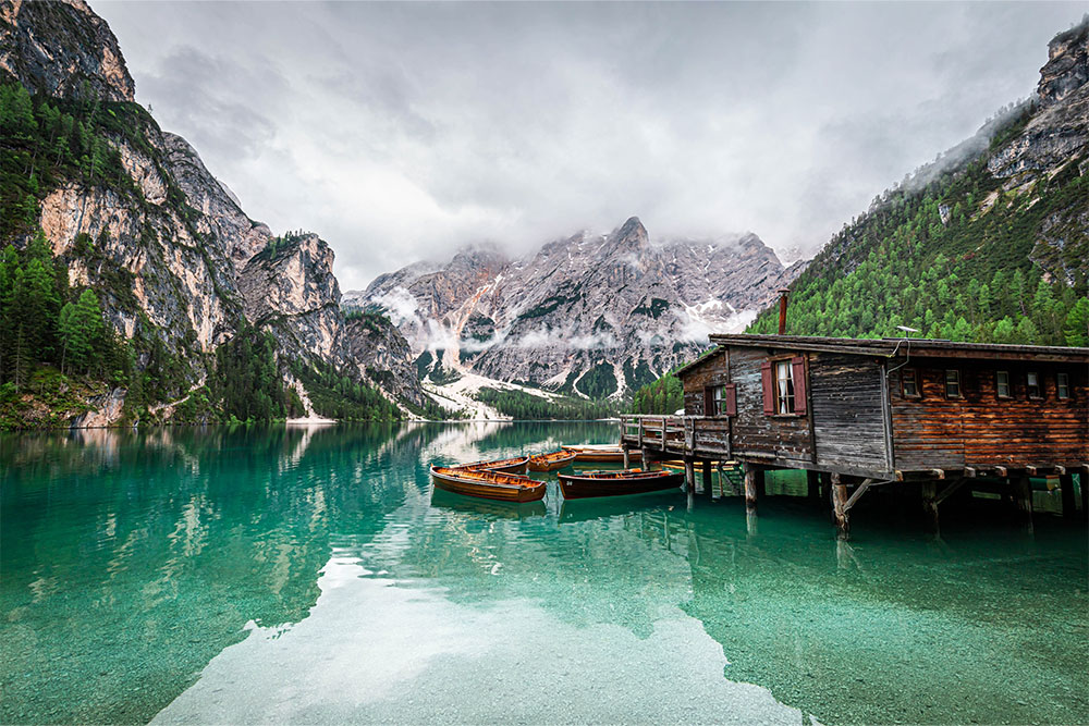lago di braies wooden boats dolomites